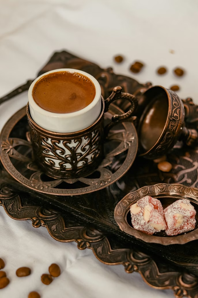 Turkish coffee served on an ornate tray with lokum