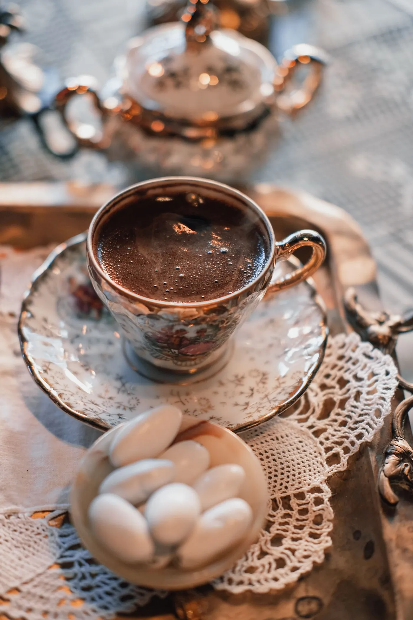 Turkish coffee served with lokum on a lace doily