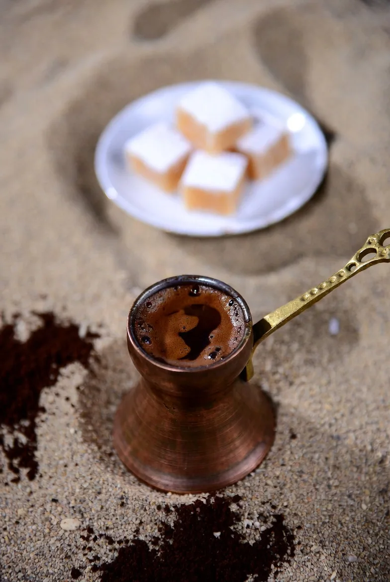 Turkish coffee with lokum on a small plate